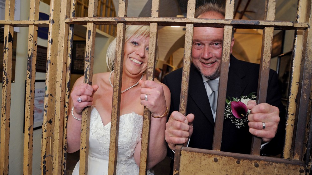 They say it's a life sentence, but Derek and Sandra Todd couldn't be happier than when they attached their ball and chain, literally, becoming the first to wed inside the Old Police Cells in Brighton, East Sussex, May 20, 2015. (Photo by Rex Features/AP)