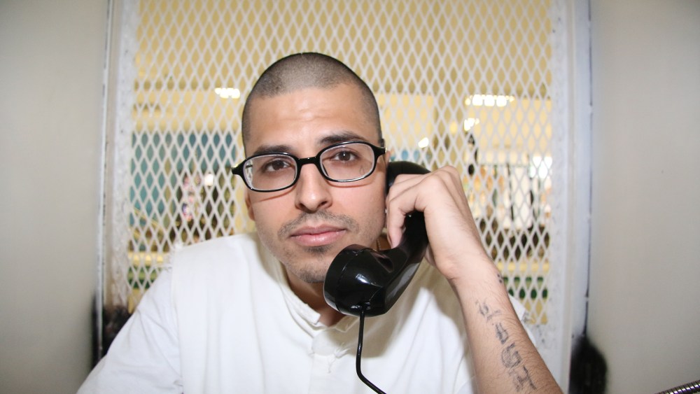 In this Aug. 5, 2015 photo, Daniel Lee Lopez, 27, speaks from a visiting cage outside death row at the Texas Department of Criminal Justice Polunsky Unit near Livingston, Texas. (Photo by Michael Graczyk/AP)