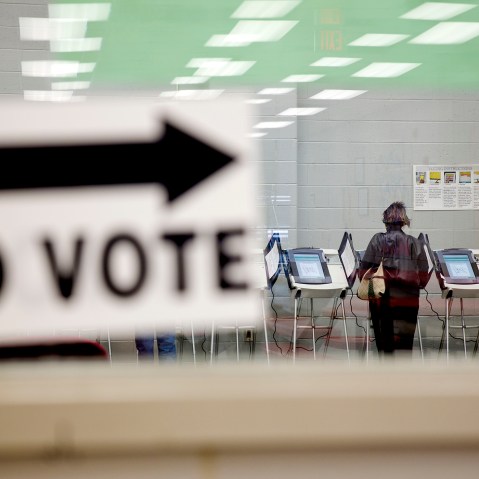 A voter casts her ballot at a polling site in Georgia on May 16, 2014. (David Goldman/AP)