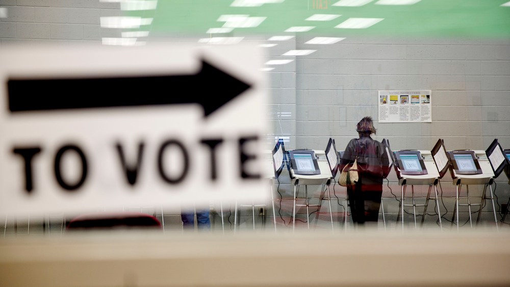 A voter casts her ballot at a polling site in Georgia on May 16, 2014. (David Goldman/AP)