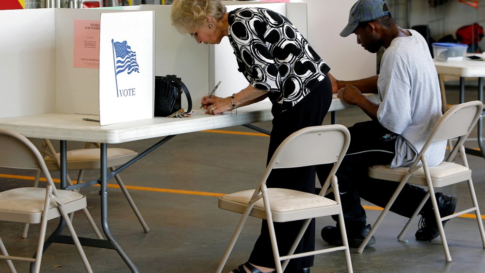 Voters cast their ballots at Clayton Fire Station in downtown Clayton, N.C. on May 6, 2014.