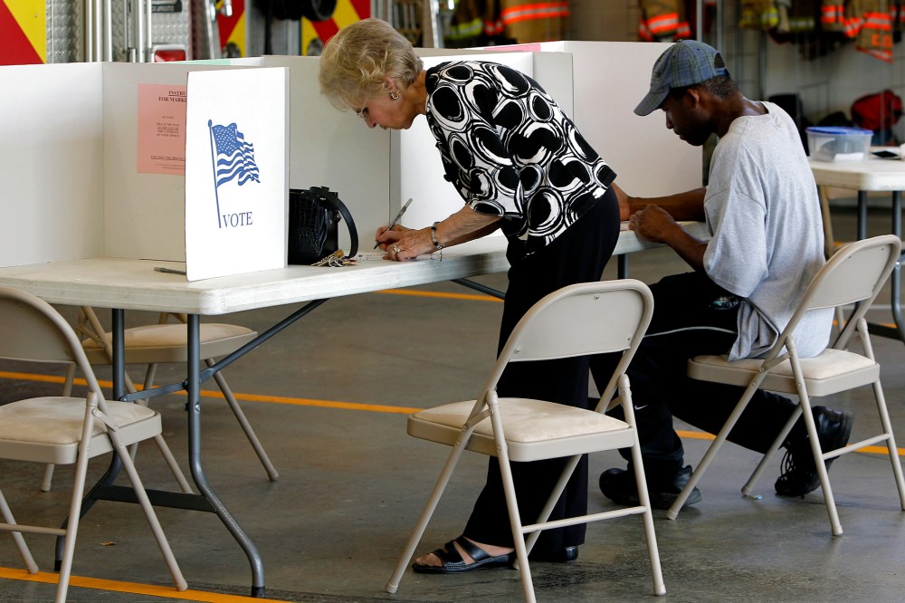 Voters cast their ballots at Clayton Fire Station in downtown Clayton, N.C. on May 6, 2014.