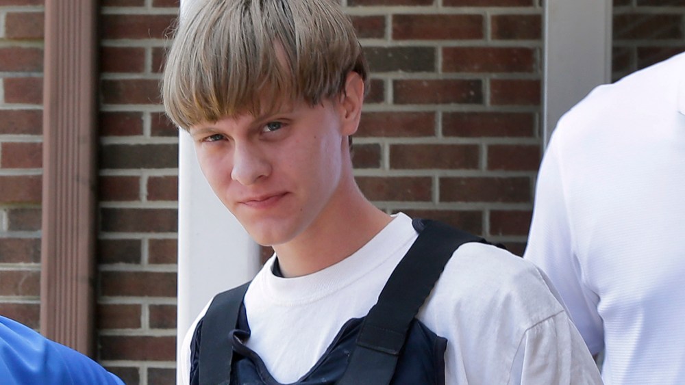 Charleston, S.C., shooting suspect Dylann Storm Roof is escorted from the Sheby Police Department in Shelby, N.C., June 18, 2015.