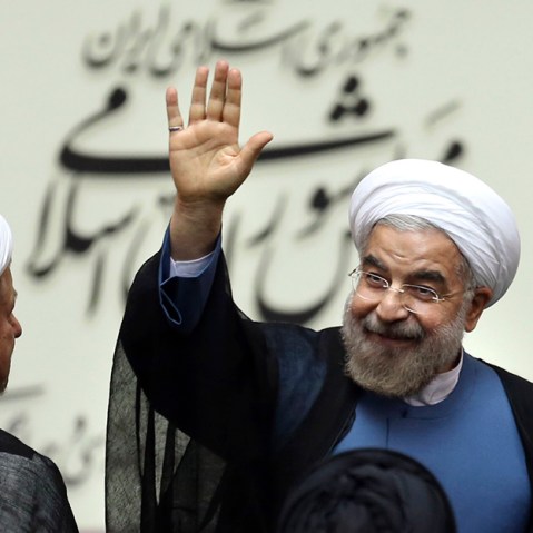 Iran's new President Hasan Rouhani, waves after swearing in at the parliament, in Tehran, Iran, Sunday, Aug. 4, 2013.  (Photo by Ebrahim Noroozi/AP)