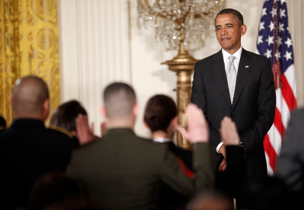 President Barack Obama, watches as the Oath of Allegiance is administered at a naturalization ceremony for active duty service members and civilians, Monday, March 25, 2013, in the East Room of the White House in Washington. (AP Photo/Pablo Martinez...
