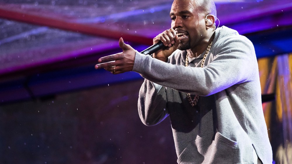 Kanye West performs in Times Square on Dec. 1, 2014 in New York, N.Y. (Photo by Charles Sykes/Invision/AP)