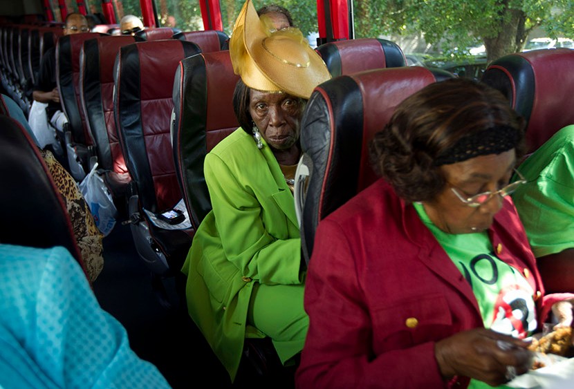 Martha Frazier rides a bus to a "Souls to the Polls" rally in Miami, Sunday, Oct. 28, 2012.  (Photo by J. Pat Carter/AP)
