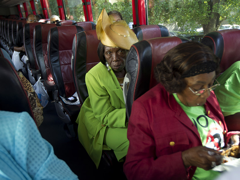 Martha Frazier rides a bus to a "Souls to the Polls" rally in Miami, Sunday, Oct. 28, 2012. (Photo by J. Pat Carter/AP)