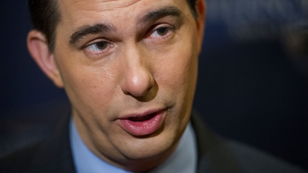 Wisconsin Gov. Scott Walker is interviewed by reporters during a break in the National Governor's Association Winter Meeting in Washington, D.C., Feb. 23, 2014.
