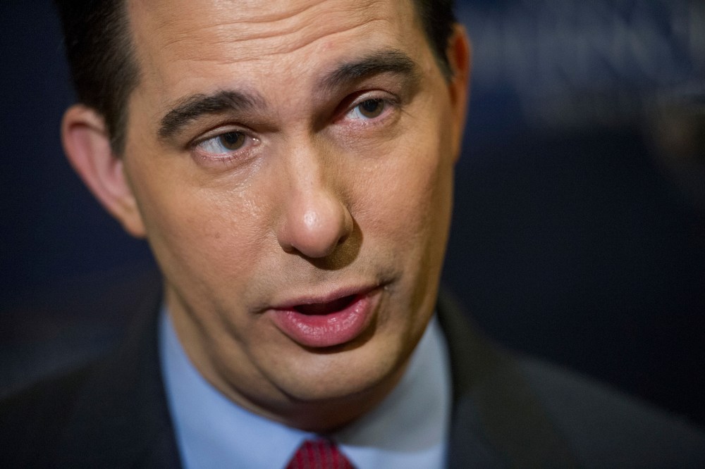 Wisconsin Gov. Scott Walker is interviewed by reporters during a break in the National Governor's Association Winter Meeting in Washington, D.C., Feb. 23, 2014.