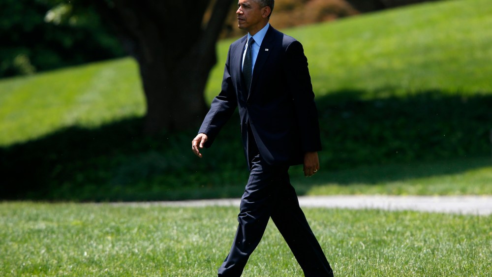 President Barack Obama walks on the South Lawn of the White House in Washington, D.C., May 22, 2014.