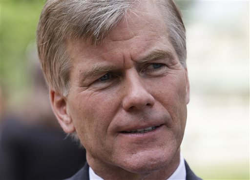 Virginia Gov. Bob McDonnell gestures as he answers reporters questions in Richmond, Va., Monday, June 24, 2013. McDonnell answered questions on the new state laws taking effect July 1. (Photo by Steve Helber/AP)