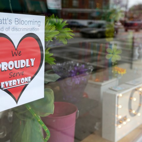 A window sign on a downtown Indianapolis florist, March 25, 2015, shows it's objection to the Religious Freedom bill passed by the Indiana legislature. (Photo by Michael Conroy/AP)