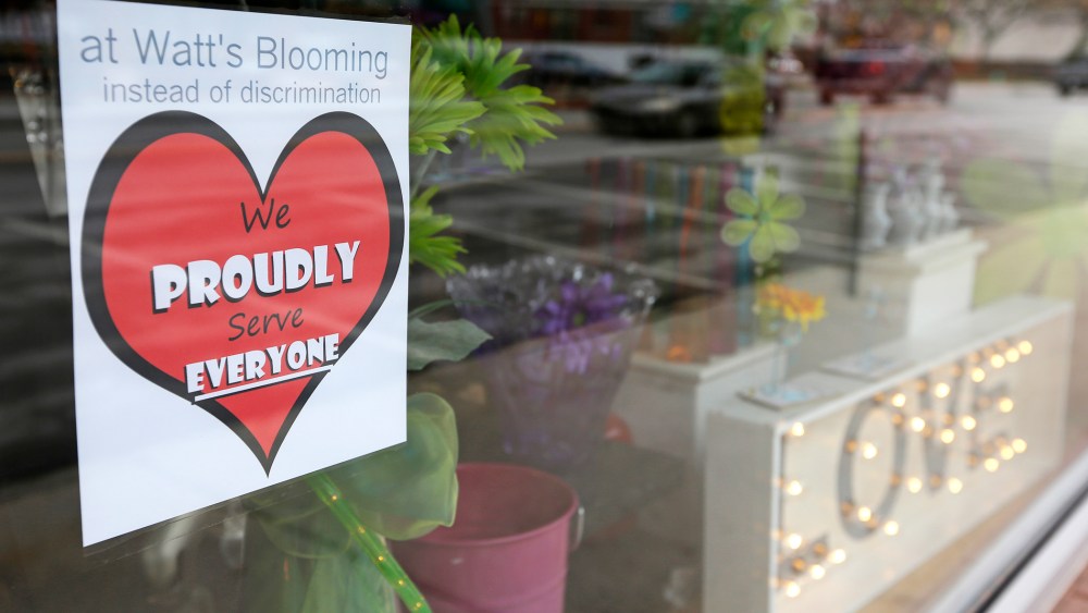 A window sign on a downtown Indianapolis florist, March 25, 2015, shows it's objection to the Religious Freedom bill passed by the Indiana legislature. (Photo by Michael Conroy/AP)