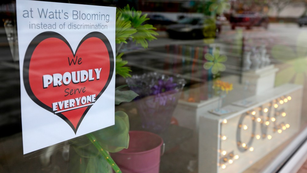 A window sign on a downtown Indianapolis florist, March 25, 2015, shows it's objection to the Religious Freedom bill passed by the Indiana legislature. (Photo by Michael Conroy/AP)