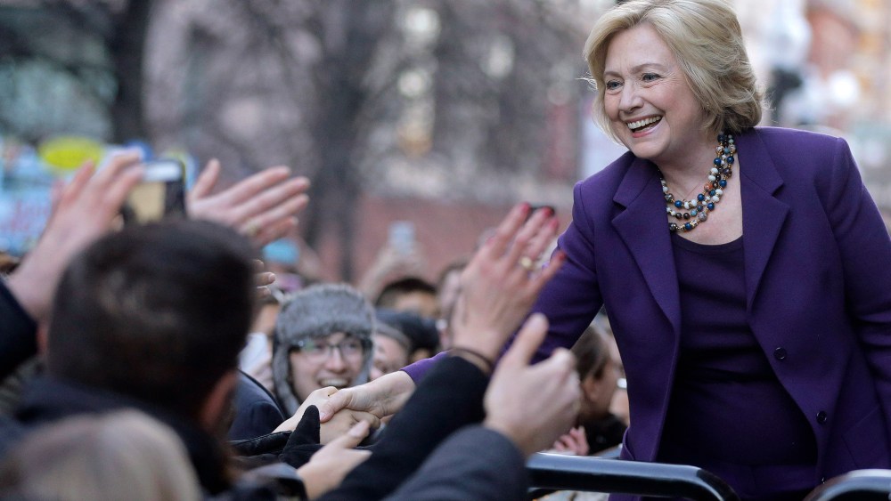 Democratic presidential candidate Hillary Clinton greets people in a crowd before a rally, "Hard Hats for Hillary," at Faneuil Hall, Nov. 29, 2015, in Boston. (Photo by Steven Senne/AP)