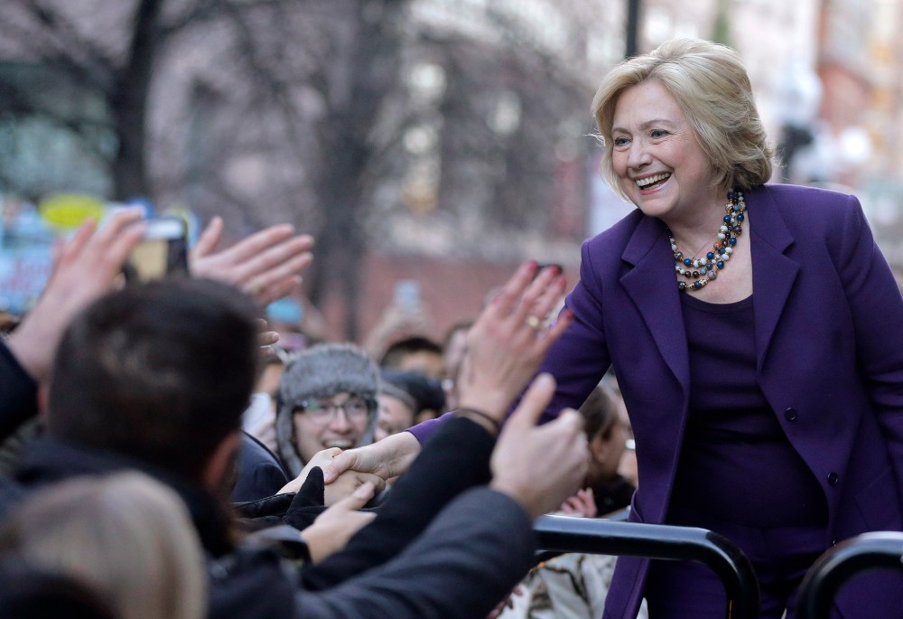 Democratic presidential candidate Hillary Clinton greets people in a crowd before a rally, "Hard Hats for Hillary," at Faneuil Hall, Nov. 29, 2015, in Boston. (Photo by Steven Senne/AP)