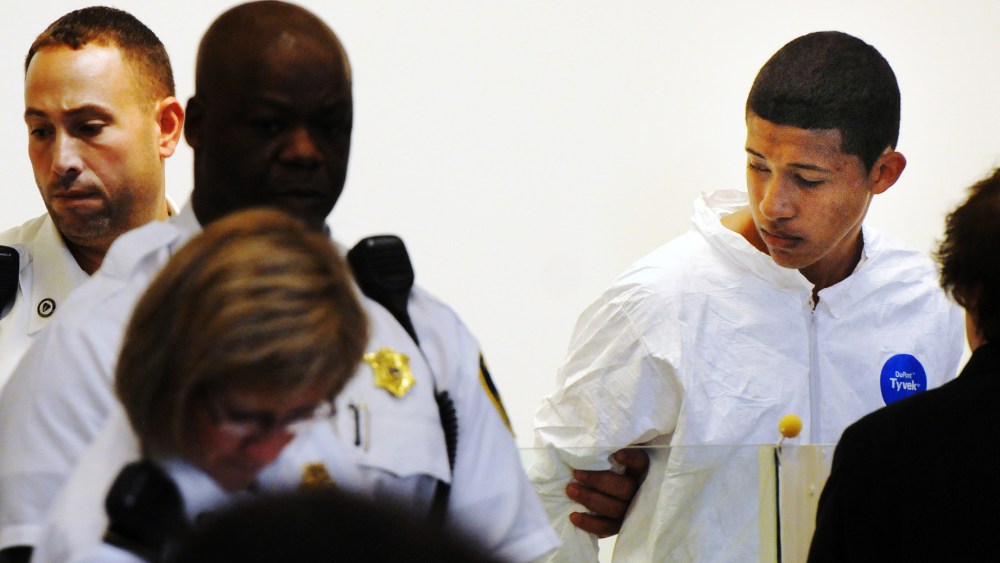 Philip Chism, 14, stands during his arraignment for the death of Danvers High School teacher Colleen Ritzer in Salem District Court in Salem, Mass., Wednesday, Oct. 23, 2013.