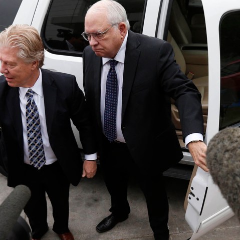 Robert Bates, right, arrives at the Tulsa County Jail with his attorney, Clark Brewster, on April 14, 2015, in Tulsa, Okla.