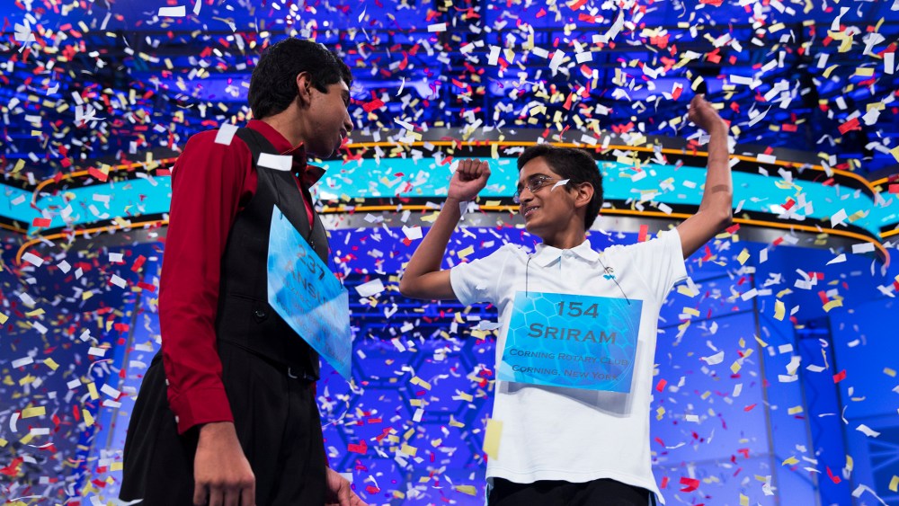 Ansun Sujoe, 13, of Fort Worth, Texas, left, and Sriram Hathwar, 14, of Painted Post, N.Y., celebrate after being named co-champions of the National Spelling Bee, May 29, 2014, in Oxon Hill, Md.