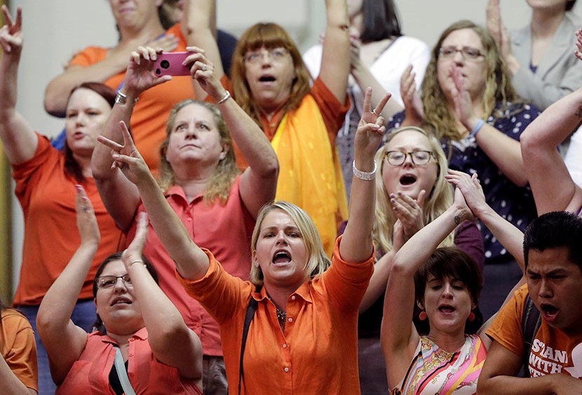 In this June 26, 2013 file photo, members of the gallery cheer and chant as the Texas Senate tries to bring an abortion bill to a vote as time expires, in Austin, Texas. (Photo by Eric Gay/AP)