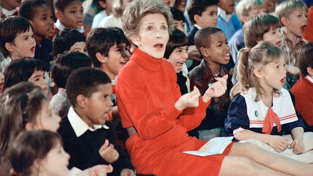 First Lady Nancy Reagan watches an anti-drug musical entitled Just Say No performed by teenage students from the Chantilly, Va., High School at the Cameron Elementary School, Feb. 26, 1987. (Photo by Scott Stewart/AP)