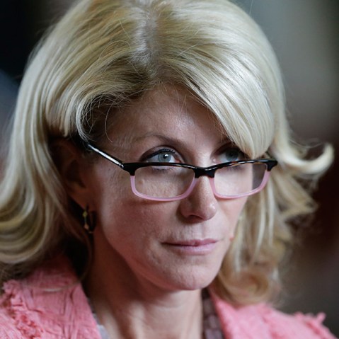 Sen. Wendy Davis, D-FortWorth, listens as the Texas Senate debate an abortion bill before the final vote, Friday, July 12, 2013, in Austin, Texas. The bill would require doctors to have admitting privileges at nearby hospitals, only allow abortions in...