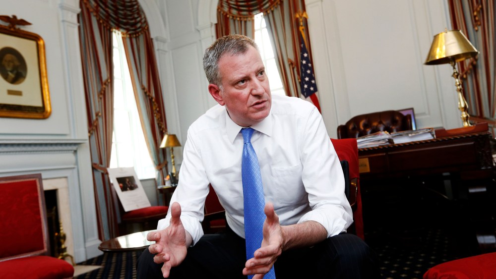 New York Mayor Bill de Blasio gives an interview at City Hall in New York, April 9, 2014.