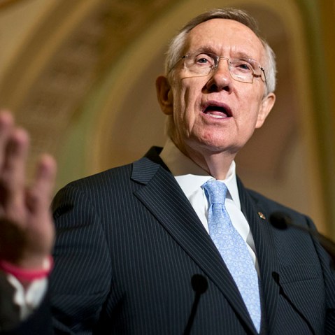 Senate Majority Leader Harry Reid of Nev. gestures as he speaks with reporters on Capitol in Washington, Tuesday, July 9, 2013 (Photo by J. Scott Applewhite/AP)