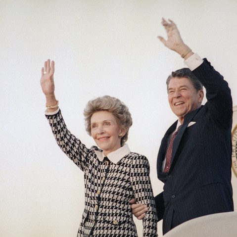 President Ronald Reagan and Mrs. Reagan wave from Air Force One at Andrews Air Force Base in evening on Sep. 8, 1986 as they return to Washington. (Photo by J. Scott Applewhite/AP)