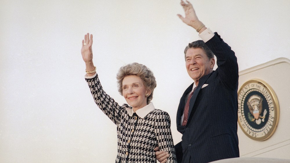 President Ronald Reagan and Mrs. Reagan wave from Air Force One at Andrews Air Force Base in evening on Sep. 8, 1986 as they return to Washington. (Photo by J. Scott Applewhite/AP)