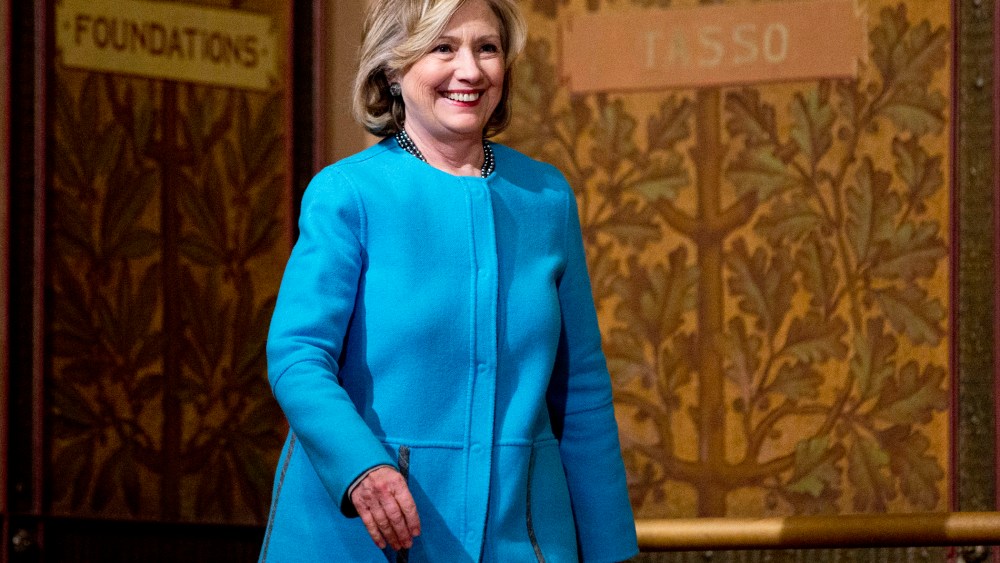 Former Secretary of State Hillary Rodham Clinton arrives to speak in Gaston Hall at Georgetown University in Washington, D.C., Dec. 3, 2014. (Photo by Carolyn Kaster/AP)
