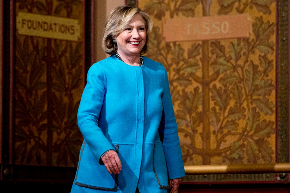 Former Secretary of State Hillary Rodham Clinton arrives to speak in Gaston Hall at Georgetown University in Washington, D.C., Dec. 3, 2014. (Photo by Carolyn Kaster/AP)