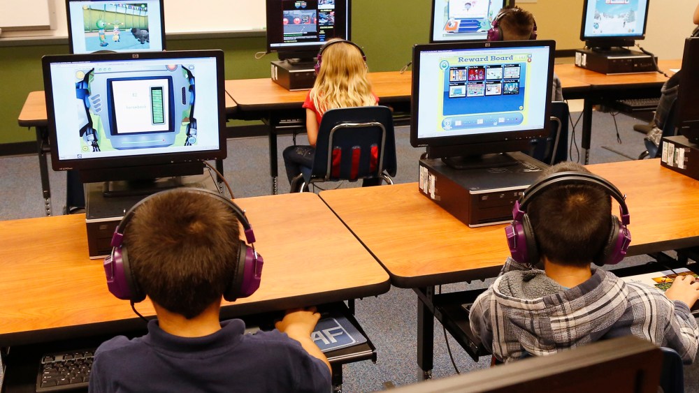 Students at Buchanan elementary school work in the computer lab in Oklahoma City, July 21, 2014. President Obama called Saturday for capping standardized testing at 2 percent of classroom time. (Photo by Sue Ogrocki/AP)
