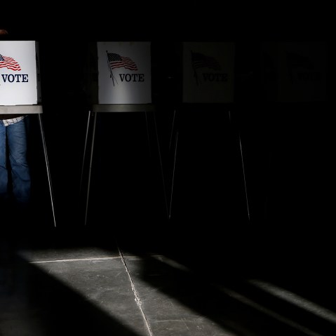 Voting booths are illuminated by sunlight as voters cast their ballots at a polling place on Nov. 6, 2012. (Photo by Jae C. Hong/AP)