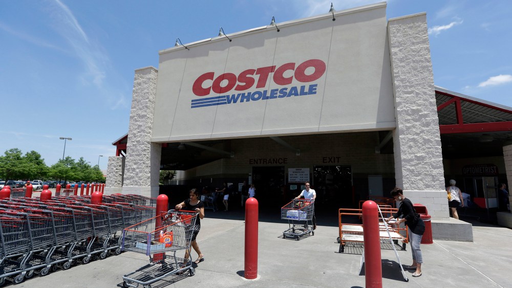 Shoppers push carts out of a Costco in Plano, Texas, June 4, 2014. (Photo by LM Otero/AP)