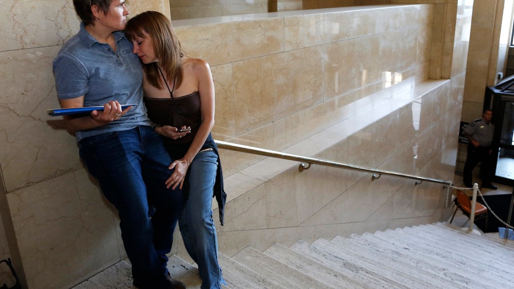 Pat Cline, left, and Patty McKenzie wait to get married at the Milwaukee County Courthouse June 6, 2014, in Milwaukee, Wis.