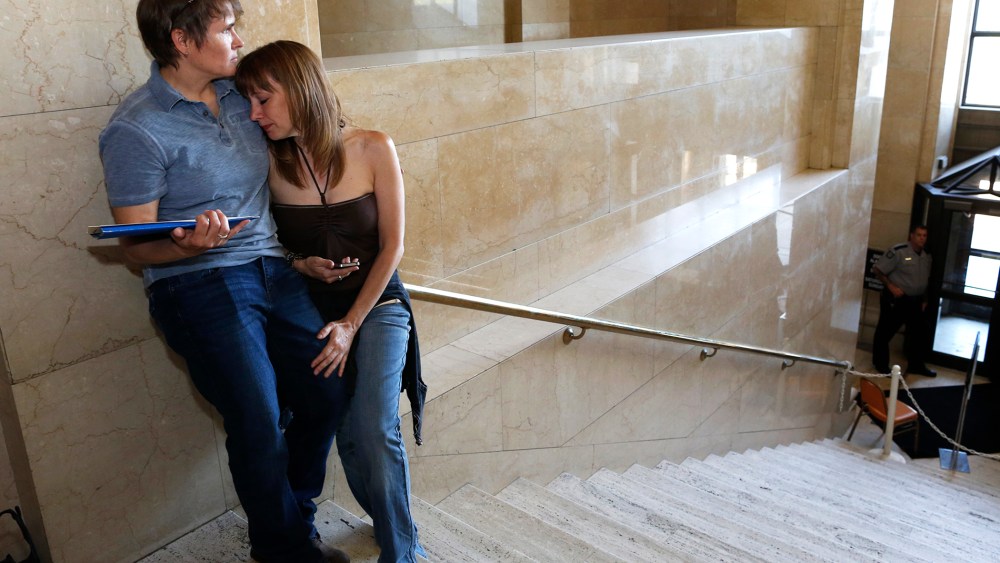 Pat Cline, left, and Patty McKenzie wait to get married at the Milwaukee County Courthouse June 6, 2014, in Milwaukee, Wis.