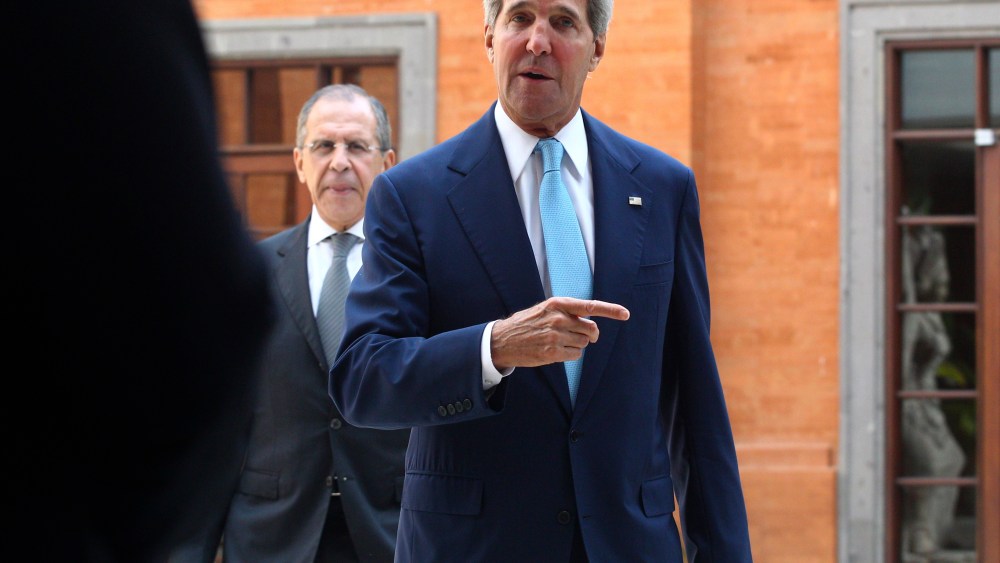 U.S. Secretary of State John Kerry gestures as he walks followed by Russian Foreign Minister Sergey Lavrov for a bilateral meeting on the sidelines of the Asia-Pacific Economic Cooperation (APEC) summit in Bali, Indonesia, Monday, Oct. 7, 2013.
