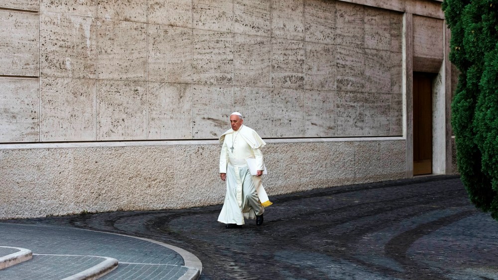Pope Francis arrives at the morning session of a two-week synod at the Vatican, Oct. 6, 2014. (Photo by Alessandra Tarantino/AP)