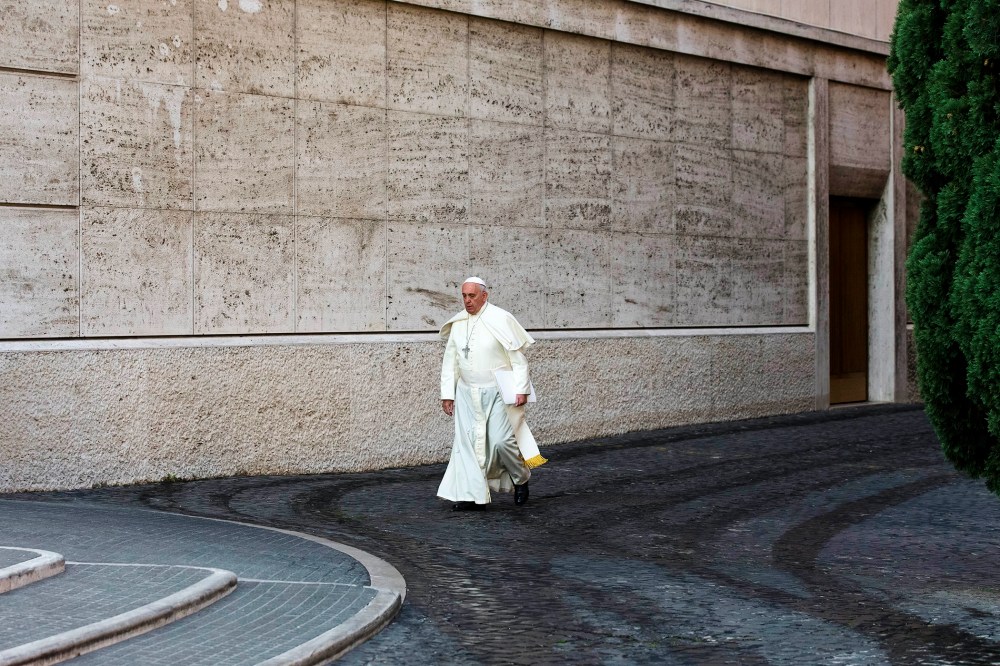Pope Francis arrives at the morning session of a two-week synod at the Vatican, Oct. 6, 2014. (Photo by Alessandra Tarantino/AP)