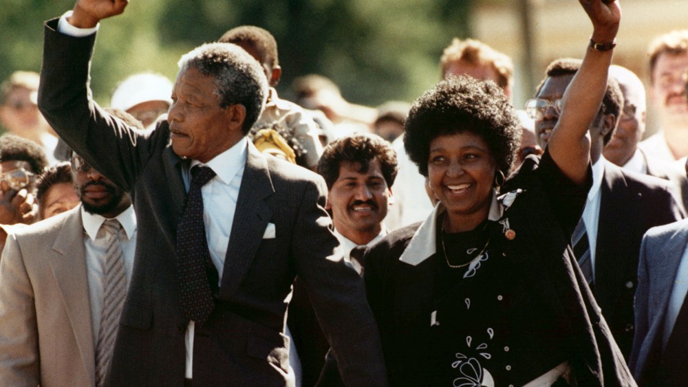 Nelson Mandela and wife Winnie, raise clenched fists upon his release from prison in Cape Town on Feb. 11, 1990. (Photo by Greg English/AP)