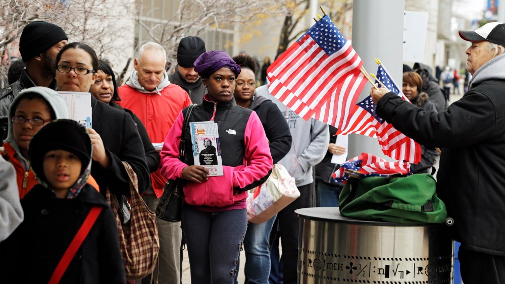 Voters wait in line outside the Cuyahoga County Board of Elections in Cleveland, Ohio on the final day of early voting Nov. 5, 2012.