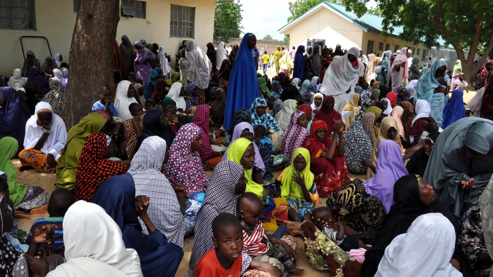 Civilians who fled their homes following an attacked by Islamist militants, in Bama, take refuge at a school in Maiduguri, Nigeria, Sept. 9, 2014. (Photo by Jossy Ola/AP)