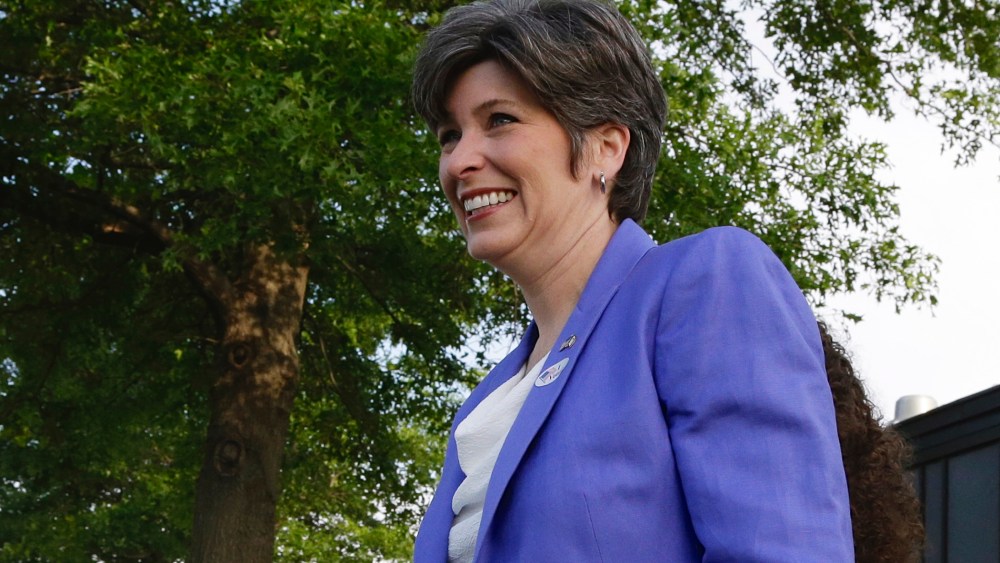 Republican U.S. Senate candidate Joni Ernst leaves the polling station after casting her ballot in Iowa'­s Republican primary in Red Oak, Iowa, June 3, 2014.