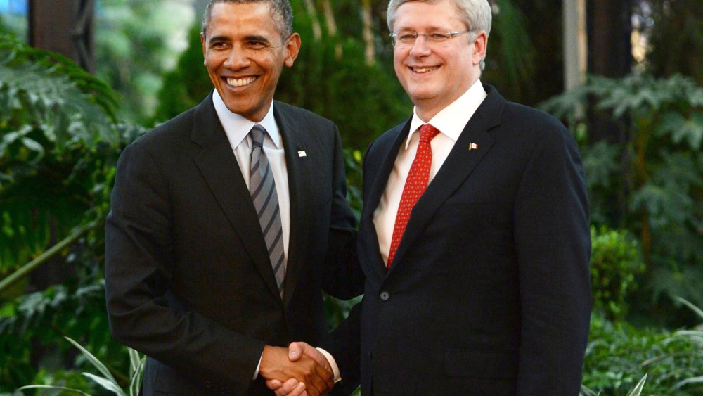 Canada's Prime Minister Stephen Harper shakes hands with President Barack Obama during the North American Leaders Summit in Toluca, Mexico,Feb. 19, 2014.