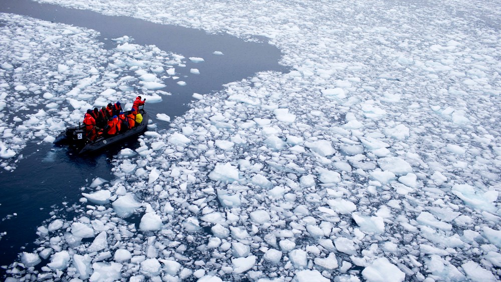 In this Jan. 22, 2015 photo, a zodiac carrying a team of international scientists heads to Chile's station Bernardo O'Higgins, Antarctica. (Photo by Natacha Pisarenko/AP)