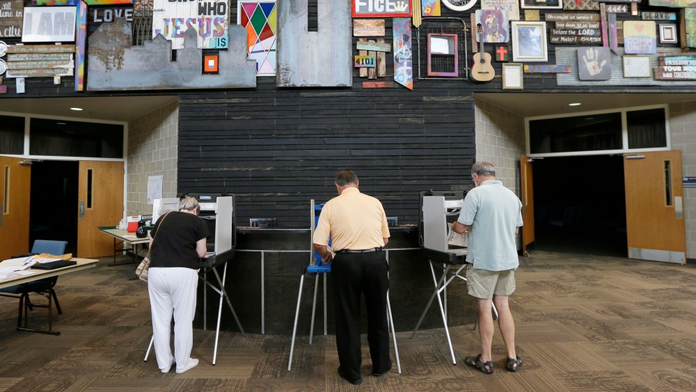 Voters fill out their ballots in Iowa's primary election, West Des Moines, Iowa, June 3, 2014.