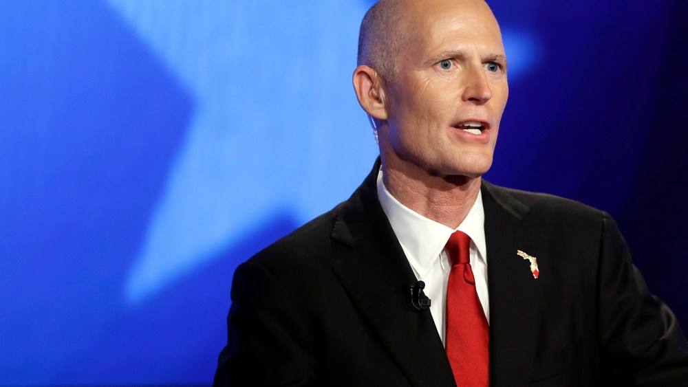 Florida Republican Gov. Rick Scott responds to a question during a gubernatorial debate against Democrat Charlie Crist on Oct. 10, 2014, in Miramar, Fla. (Photo by Lynne Sladky/AP)