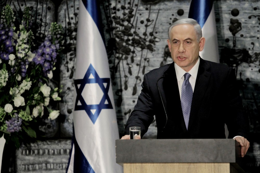 Israeli Prime Minister Benjamin Netanyahu speaks during a ceremony with Israeli President Reuven Rivlin, not seen, in Jerusalem, March 25, 2015. (Photo by Dan Balilty/AP)